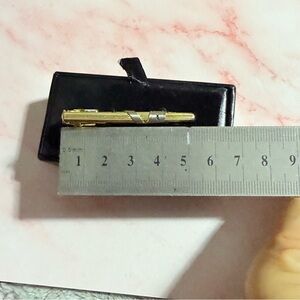 Yves Saint Laurent Gold and silver tie clip with box included